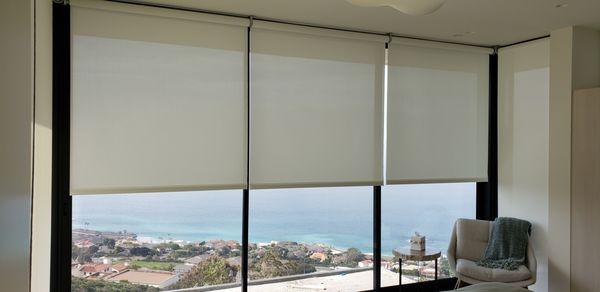 Motorized UV solar roller shades to block the sun rays. lutron shades