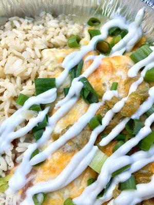 Chicken enchiladas with added green chiles, green onions, and sour cream.