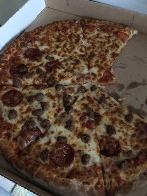 Large Half pepperoni and sausage and half cheese pizza.