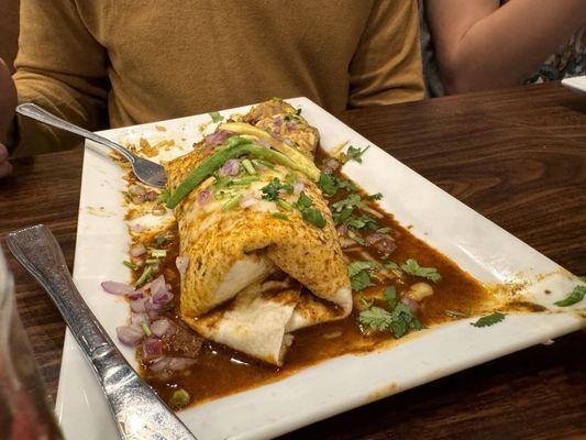 Burrito Birria with goat meat.  We felt it covered up the flavor of the goat too much with the beans and rice.