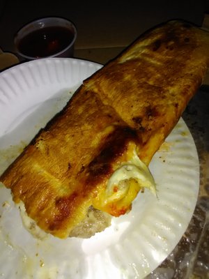 Soggy Stromboli delivered busted open and burnt!