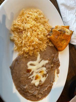 Rice and beans that come with the birria quesadilla