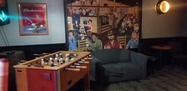 Pool room wall which also contained 1 dart board  and a bean toss game