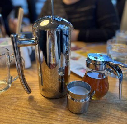 Rooibos in a French press, with side of cream and honey.