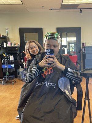 Hair stylist making the perm