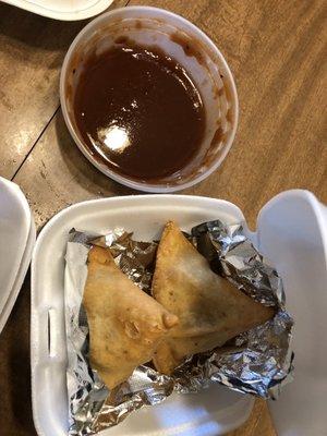 Samosas and dipping sauce.