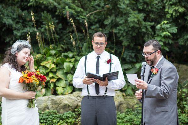 Doing the marriage thing (such a pretty backdrop for the photos!)