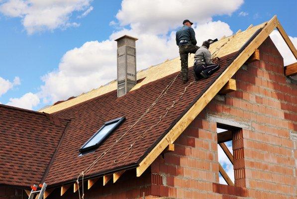 Our roofer taking safety measures very serious while replacing a shingle roof with a new beautiful finish.