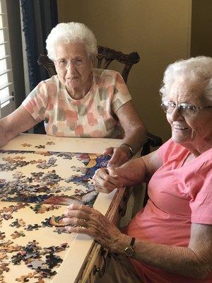 Grandma Marianna and Carol doing puzzles.