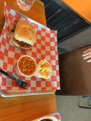 pulled pork sandwich with bake beans and mac n cheese