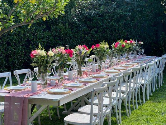 White Farmhouse table with dusty rose linens and Gold accent table settings