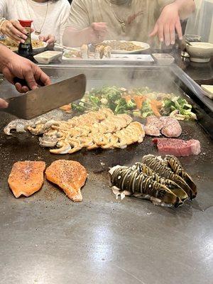 The chef was awesome. He's cooking the protein and veggies each person ordered. I was impressed with his work on the three lobsters!