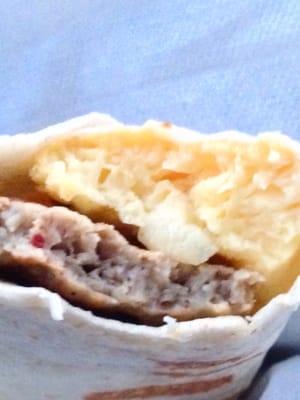 Inside the sausage, egg, and cheese breakfast wrap.    #Upclosesavor