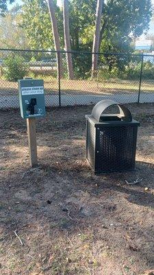 Book bag dispenser and trash can of which there are multiple