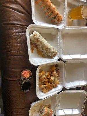 (left to right) Philadelphia, Shrimp Tempura, walnut shrimp, and Tiger Roll with a side of ginger and soy sauce