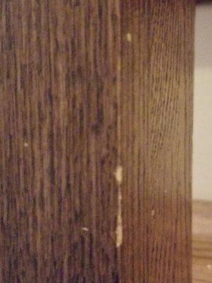 Chipped wood on staircase from running Washing Machine into it.