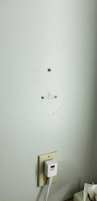 Holes left from mounted blow dryer.