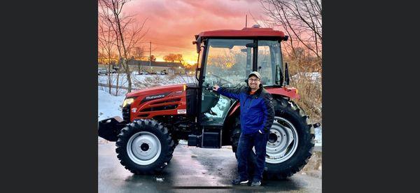 New tractor with a beautiful sunset (thank you to my wife's keen eye)