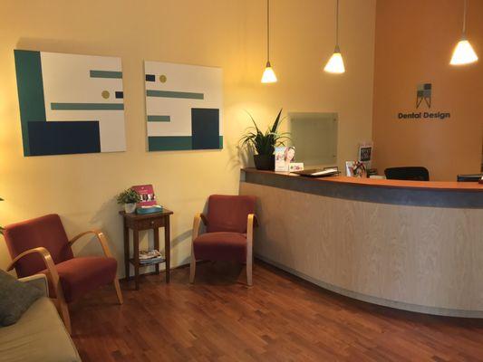 Dental Design's warm colored and cozy reception area.