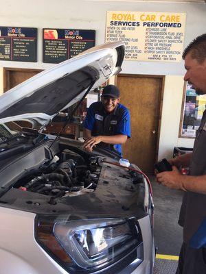 Jared D. Performing a full service oil change.