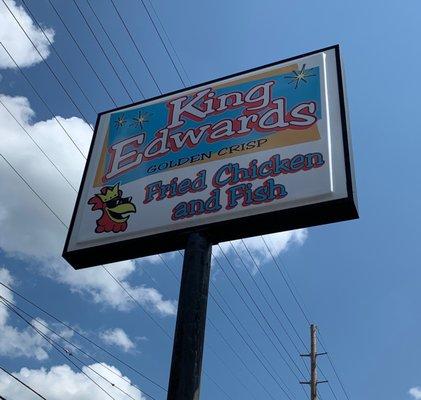 Street sign above the restaurant's off-street parking lot