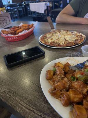 Homemade pizza and sweet potatoes fries