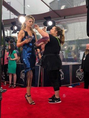 Owner Madison doing hair touch-ups on NFL Network correspondent Melissa Stark for NFL Draft