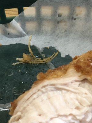 Feathers removed from fried chicken