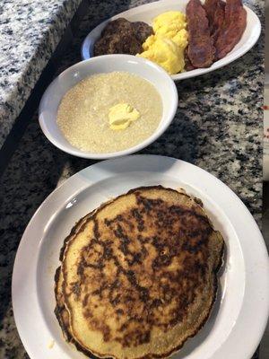 Pancakes turkey bacon, eggs, grits,toast