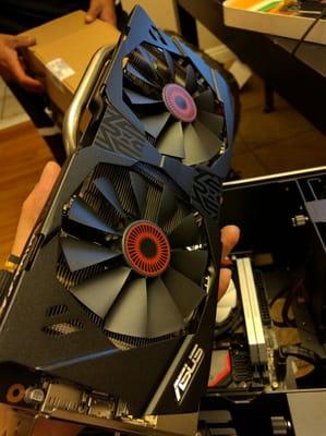 We never turn down a good custom build challenge.  Pictured, a beautiful Asus GTX 980Ti about to be installed into its new home.