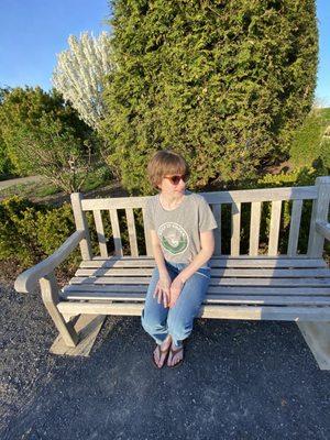 Me with my new haircut on a bench