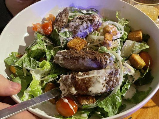 They call it a steak salad but it is loaded with a huge steak. Yum!! Check out Tavern on the Range for delicious food!!