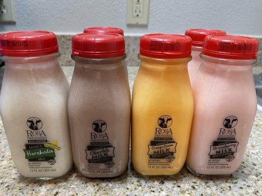 6-pack variety of flavored milks: Horchata, chocolate (2), orange cream, and strawberry (2).