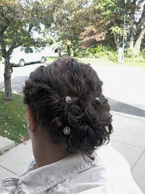 Back shot of curly twists into bun. Brought my own gem bobby pins.