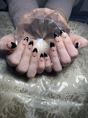 Almond nails with black heart & dot design by Jenny