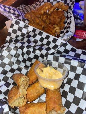 Boudin egg rolls & waffle fries.