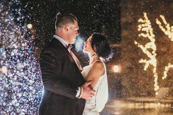 Broncos player Derek Wolfe embraces his beautiful wife Abigail during their sweet snowy wedding.