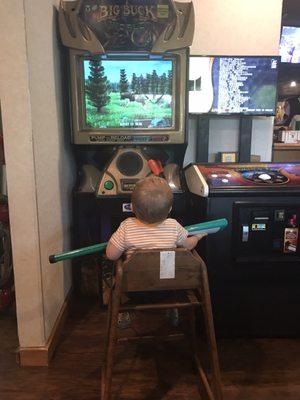 My kid enjoying his first buck hunter game