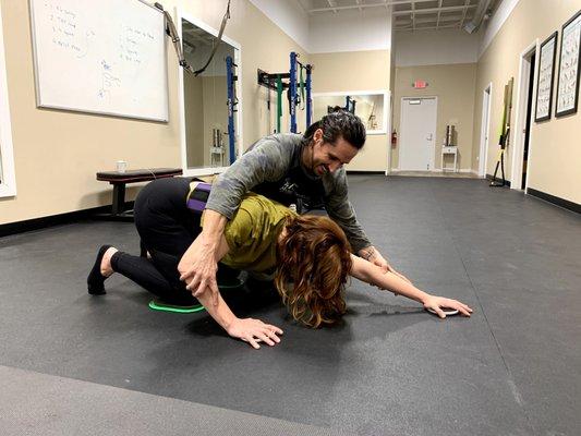 physical therapist helping patient