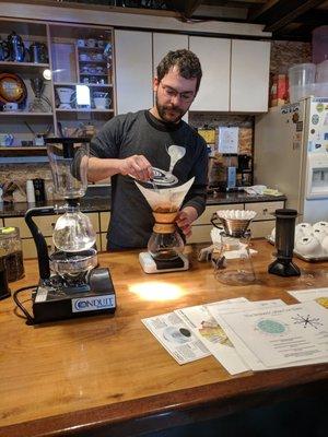 Coffee tour host, Jesse, brewing our 100th cup of coffee