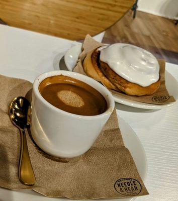 Lungo (long pull espresso) and cinnamon roll.