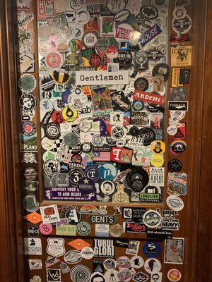 Stickers on the bathroom door.