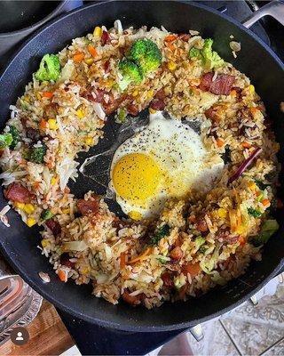 This is an order of Bacon Fried Rice being prepared for a hungry customer.