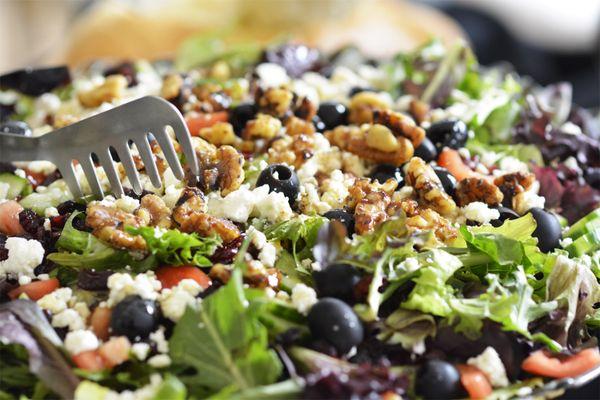 Mixed salad with walnuts, cranberries, feta cheese and our signature dressing.