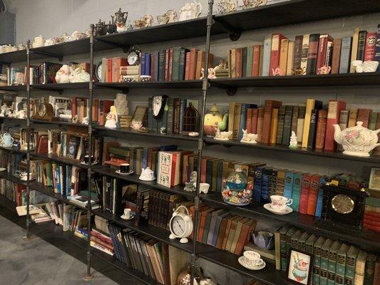 Wall of books and teapots