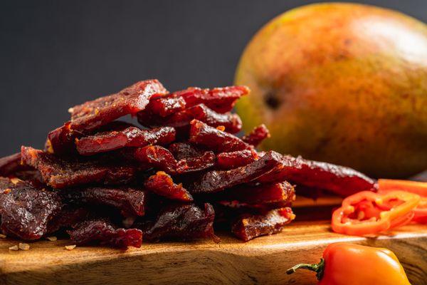 Try our slow-smoked (never dehydrated) mango habanero jerky.