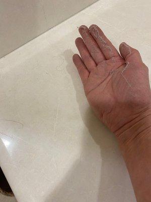 Dust from bathroom counter after cleaning