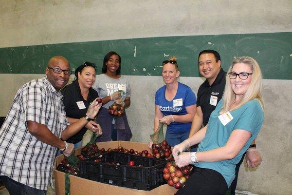 Our team helped the fight against hunger by preparing bags of fresh fruit.