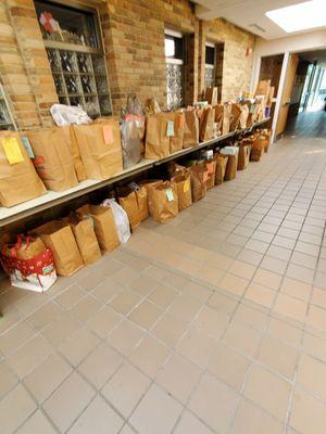 Brown Bag Food Drive - Donations from generous Parishioners on tables and floor at SJV Church. Sunday 4/14/2024