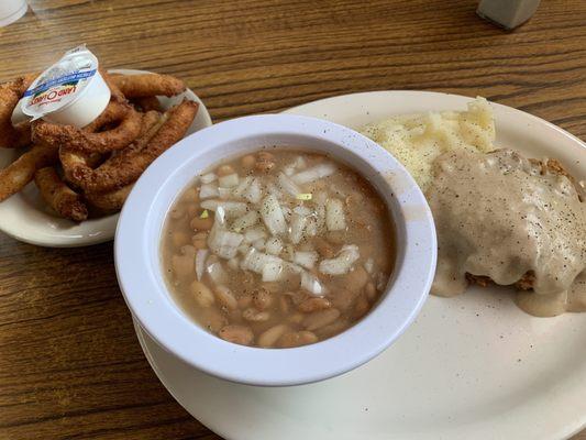 Hush puppies, pintos, potatoes and cube steak